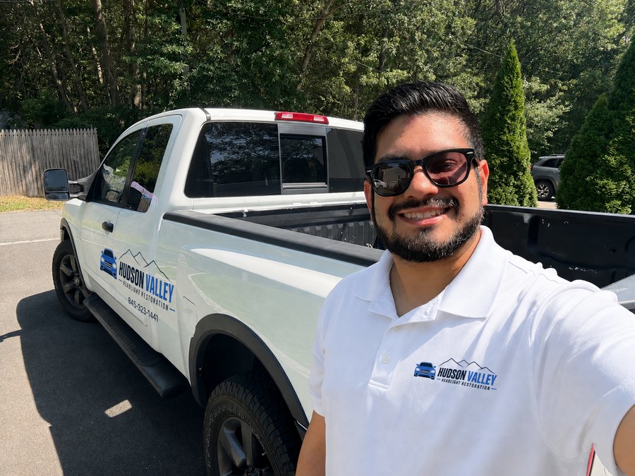 Richard, owner of Hudson Valley Headlight Restoration, beside his branded mobile service truck